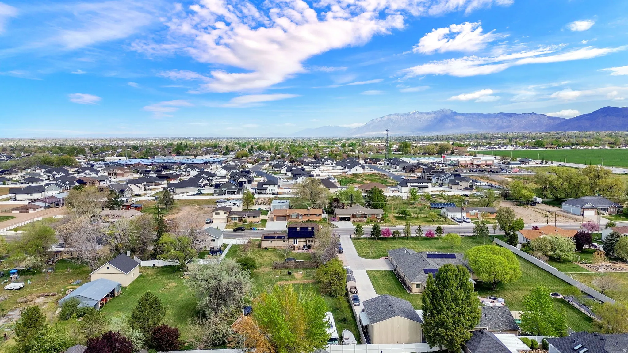 Aerial view of residential area featuring mountains