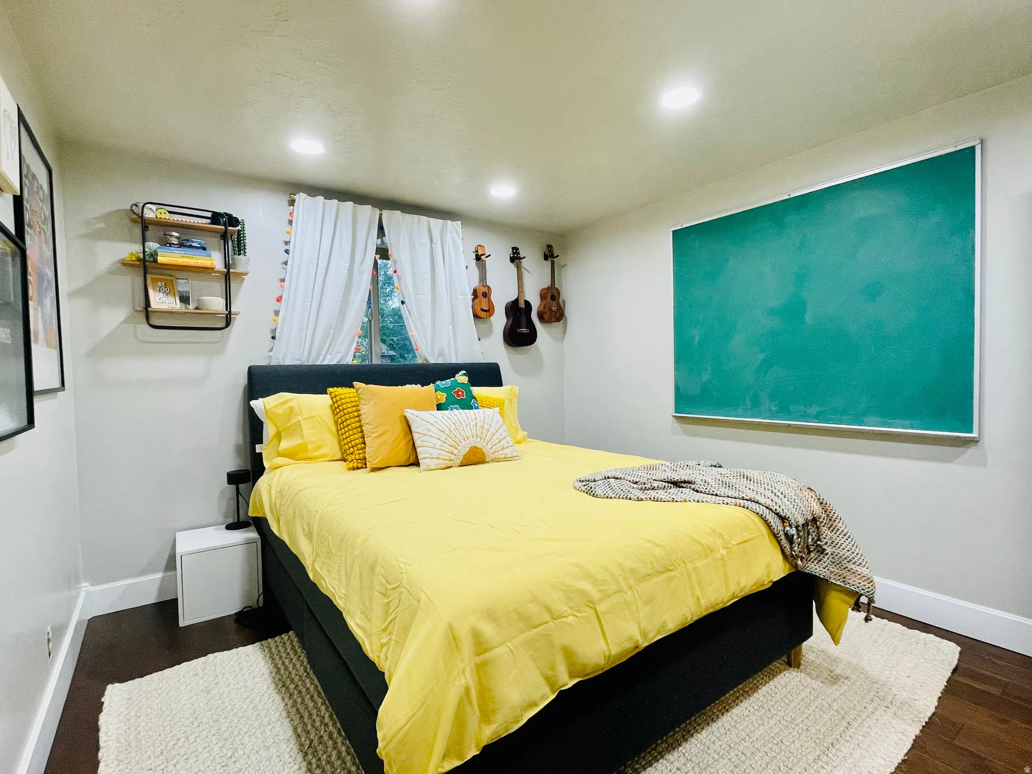 Bedroom with recessed lighting and dark wood-type flooring
