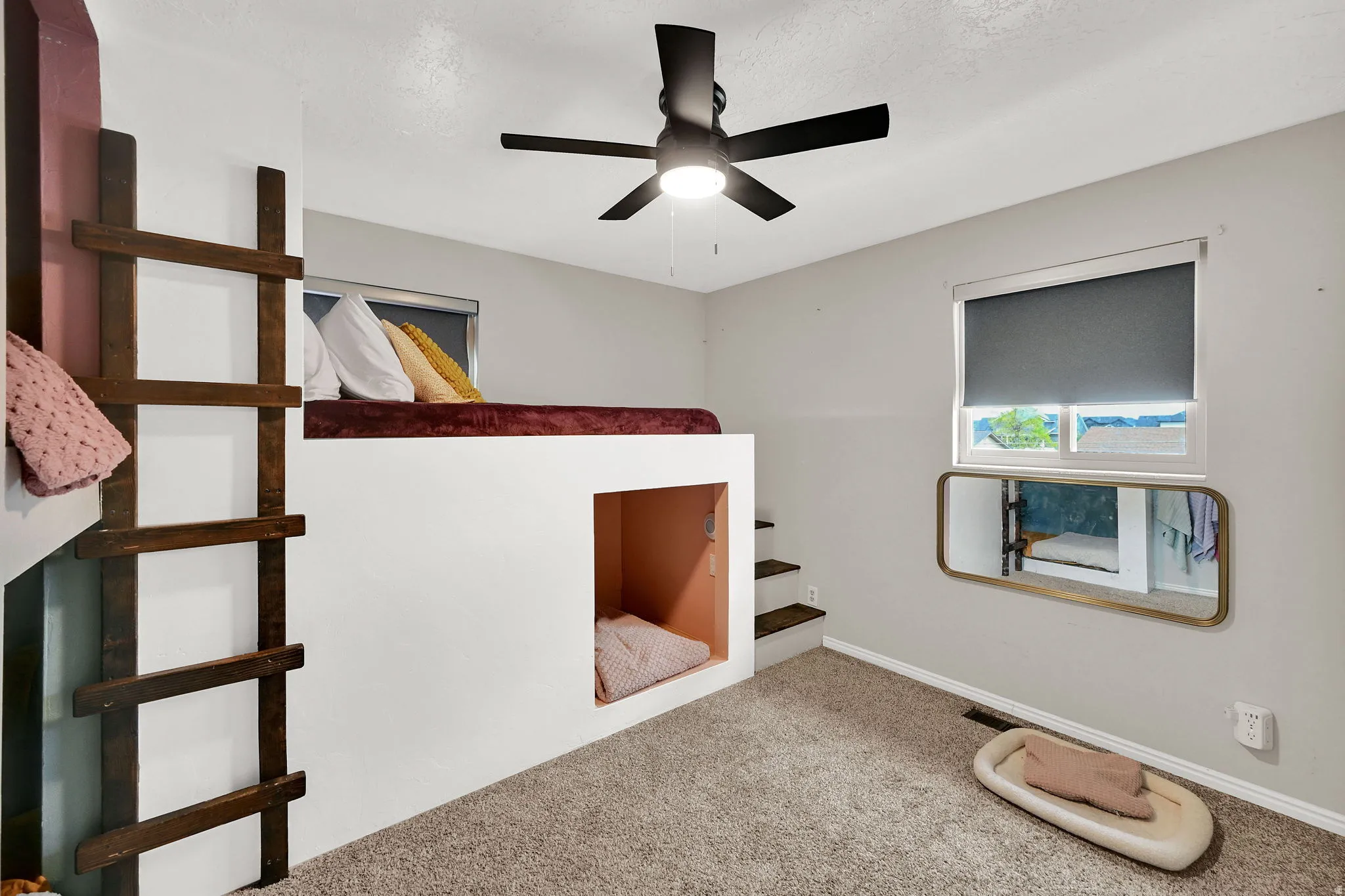 Unfurnished bedroom with carpet floors and ceiling fan