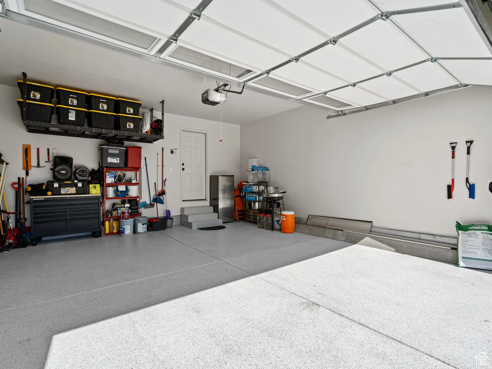 Garage featuring a garage door opener