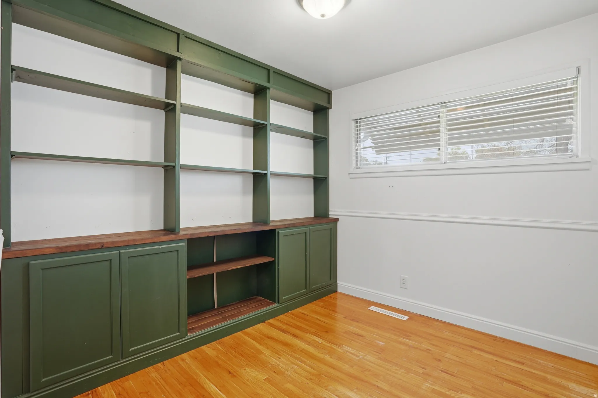 Bedroom 2 featuring baseboards and light wood-style floors