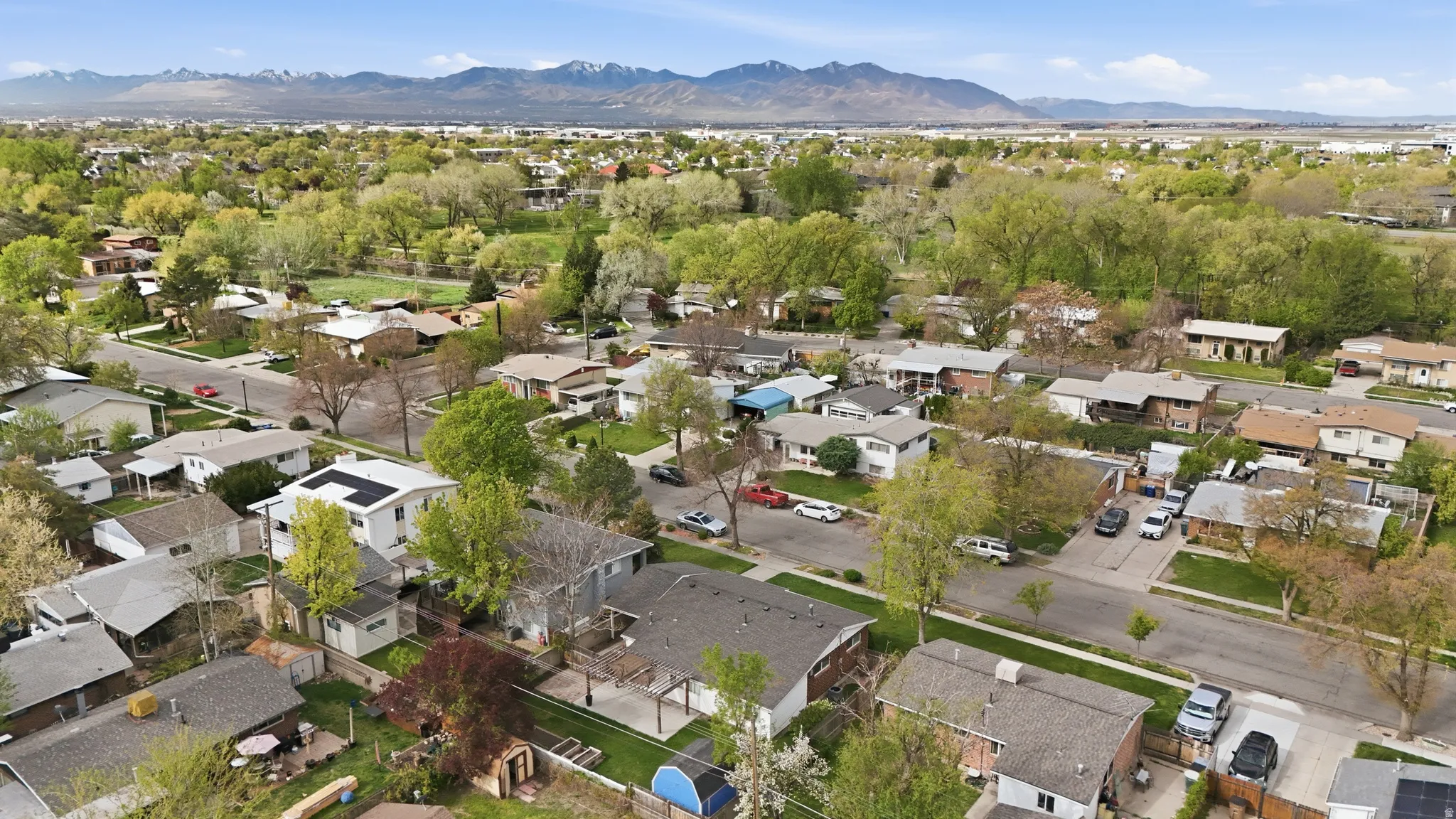 Aerial view of residential area featuring mountains