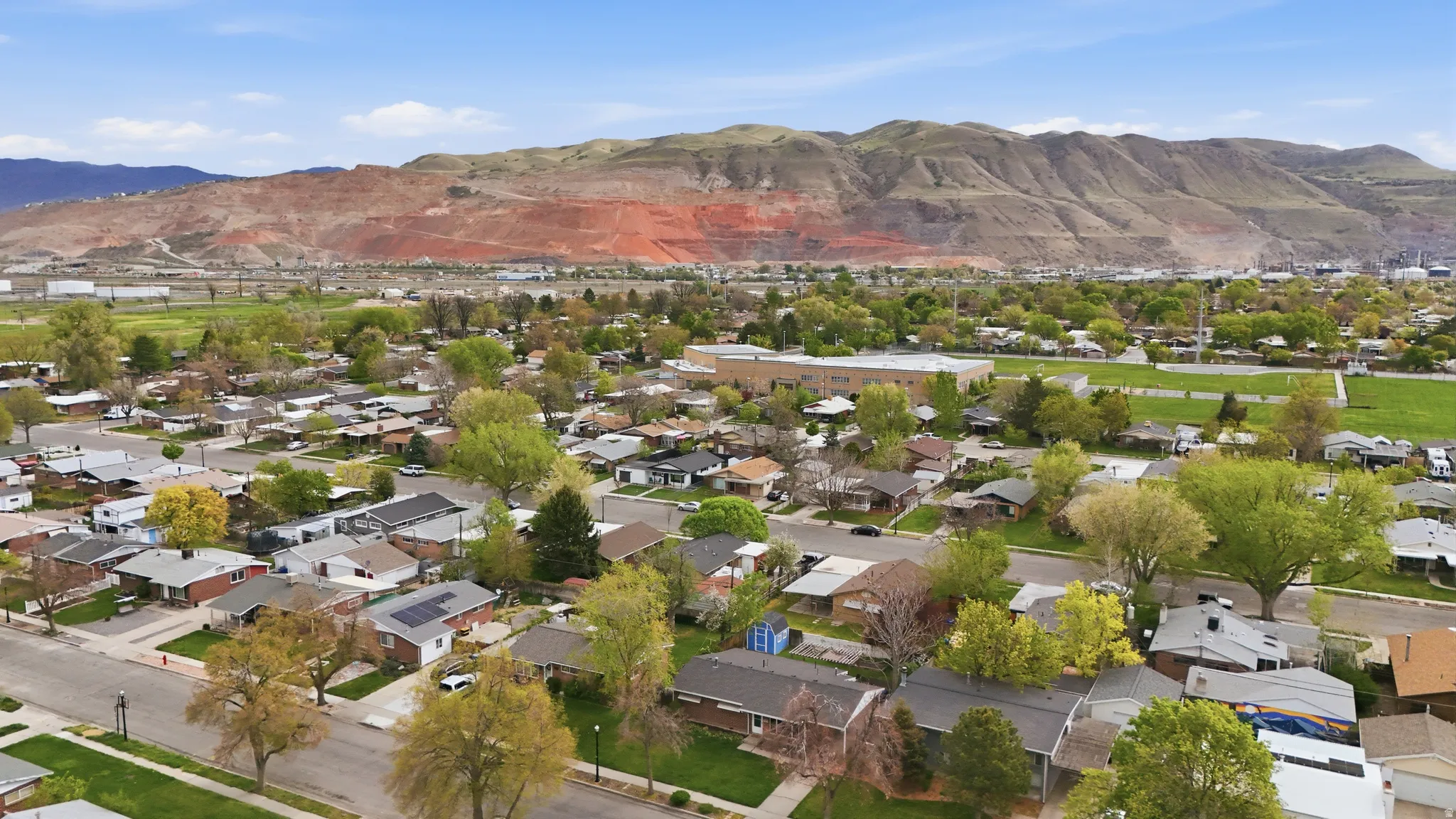 Aerial view of residential area featuring mountains