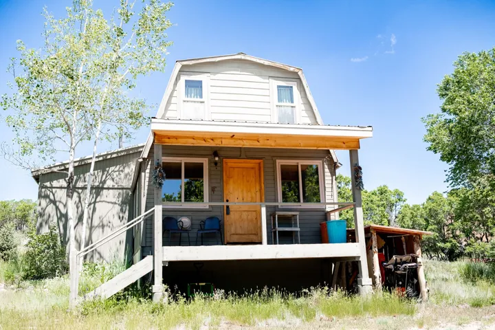 Barn-style property featuring horizontal siding and a wood-finish front door