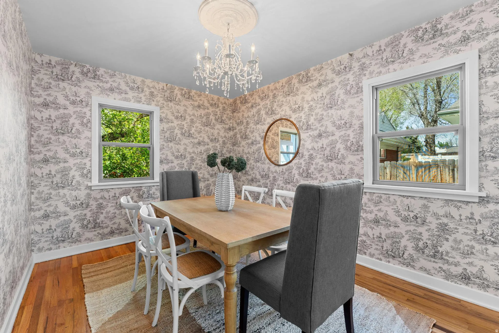 Dining room featuring hanging lights and wood finished floors