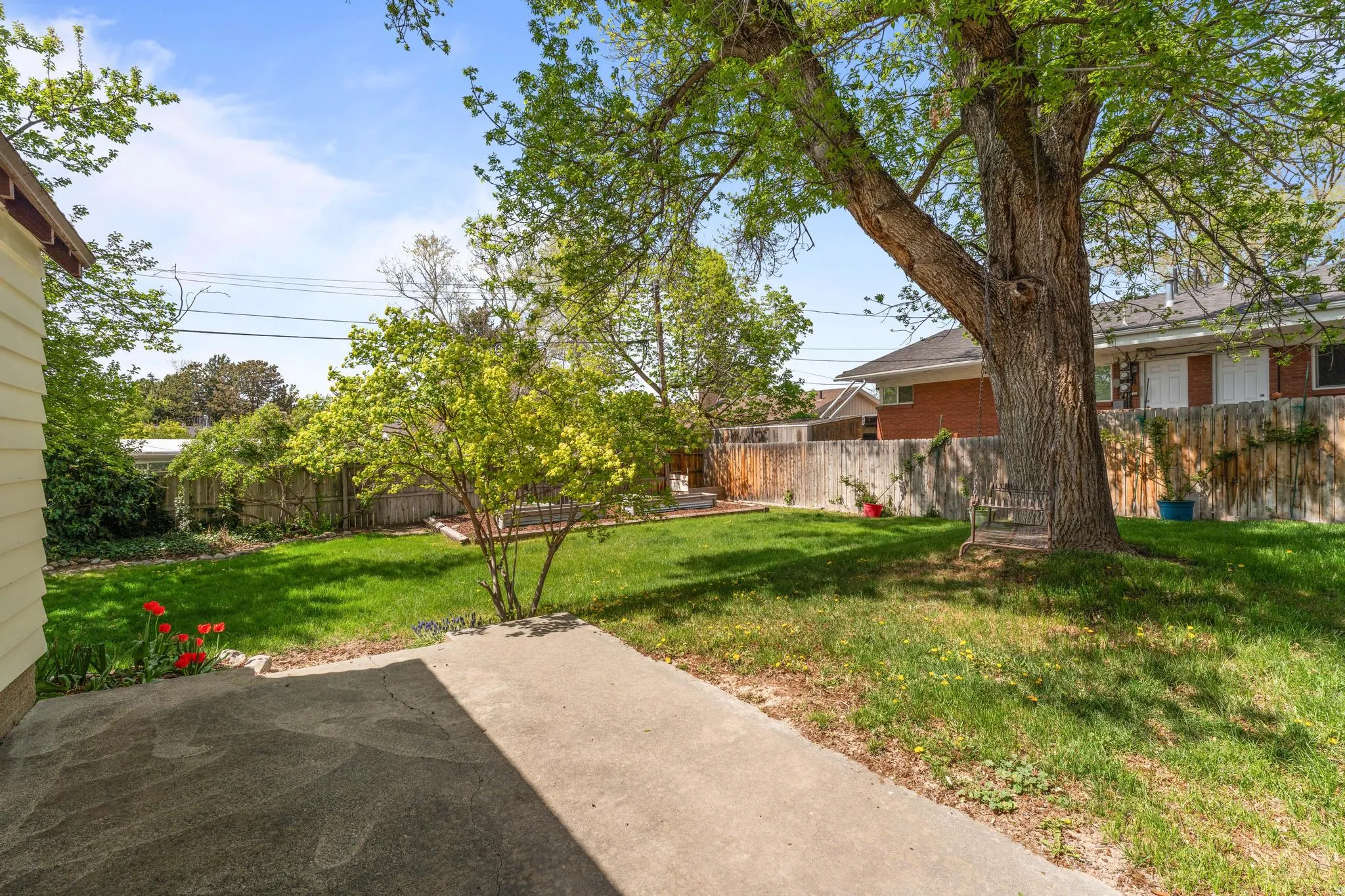 Fenced backyard with a patio