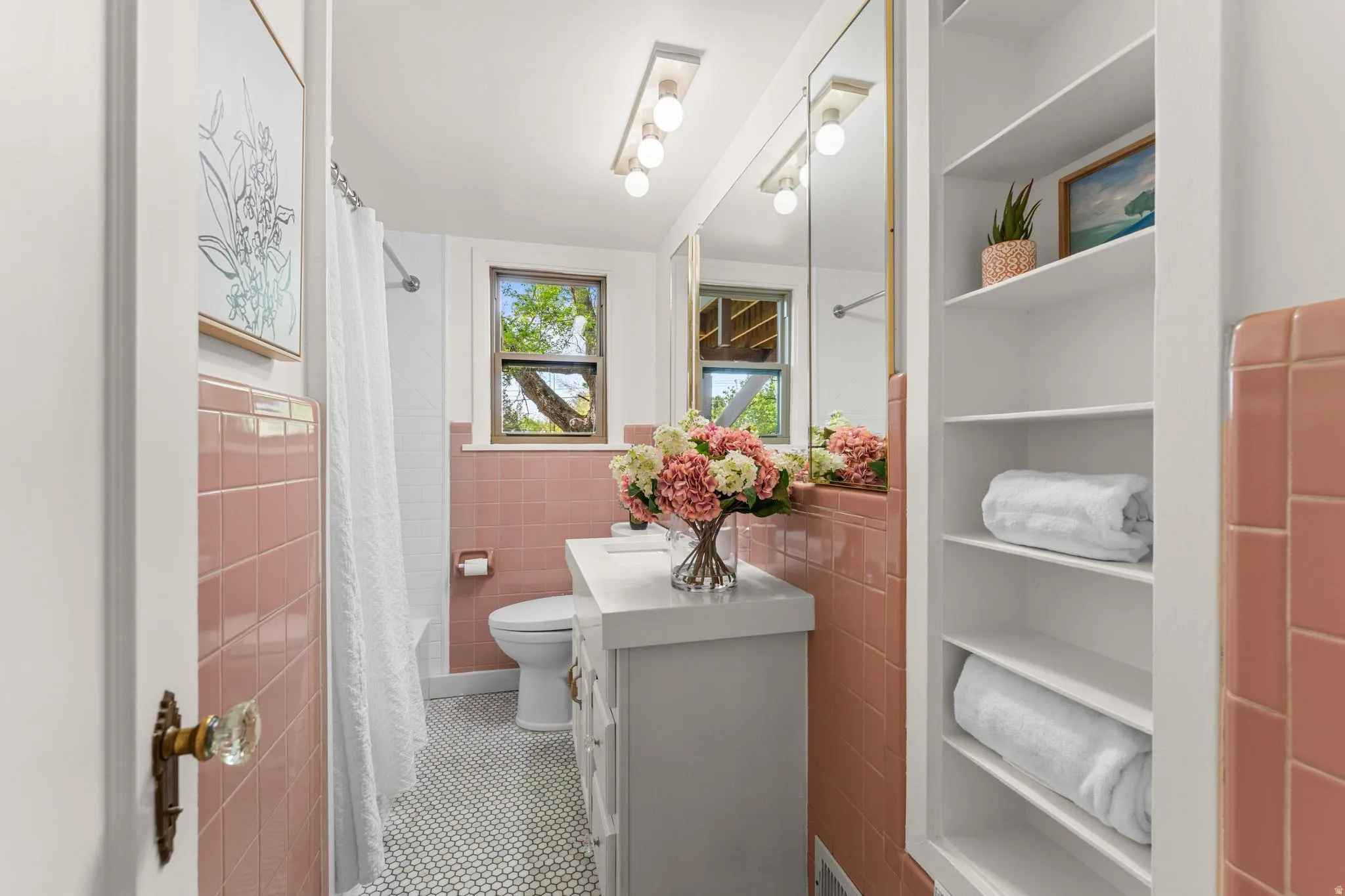 Bathroom with vanity, tile walls, a wainscoted wall, shower / tub combo, and tile patterned floors