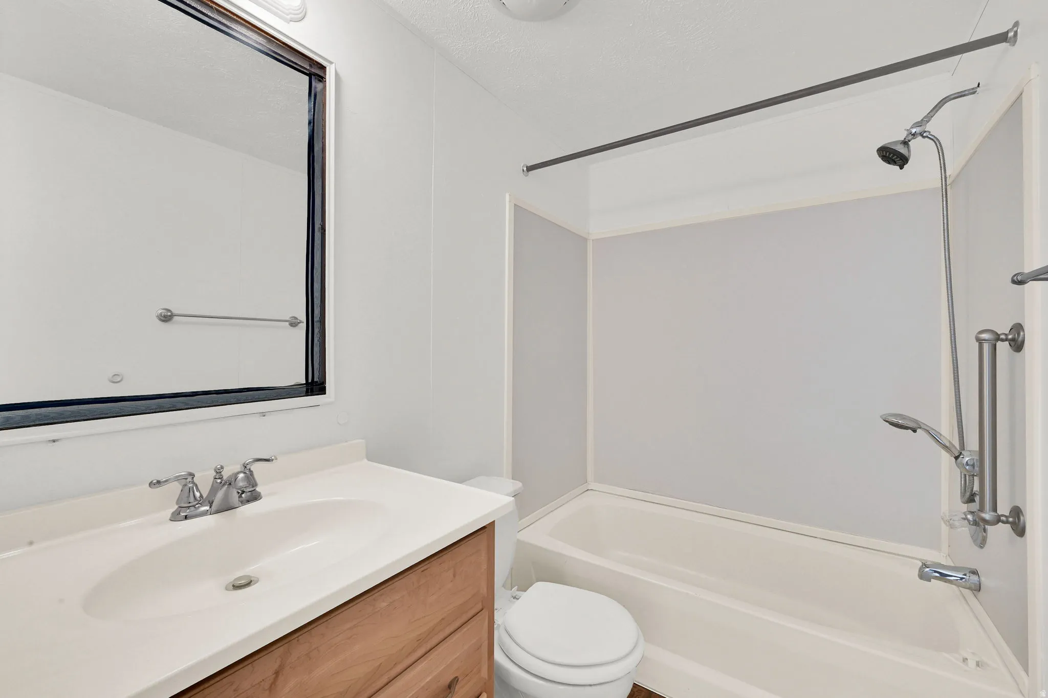 Full bathroom featuring vanity and shower / tub combination