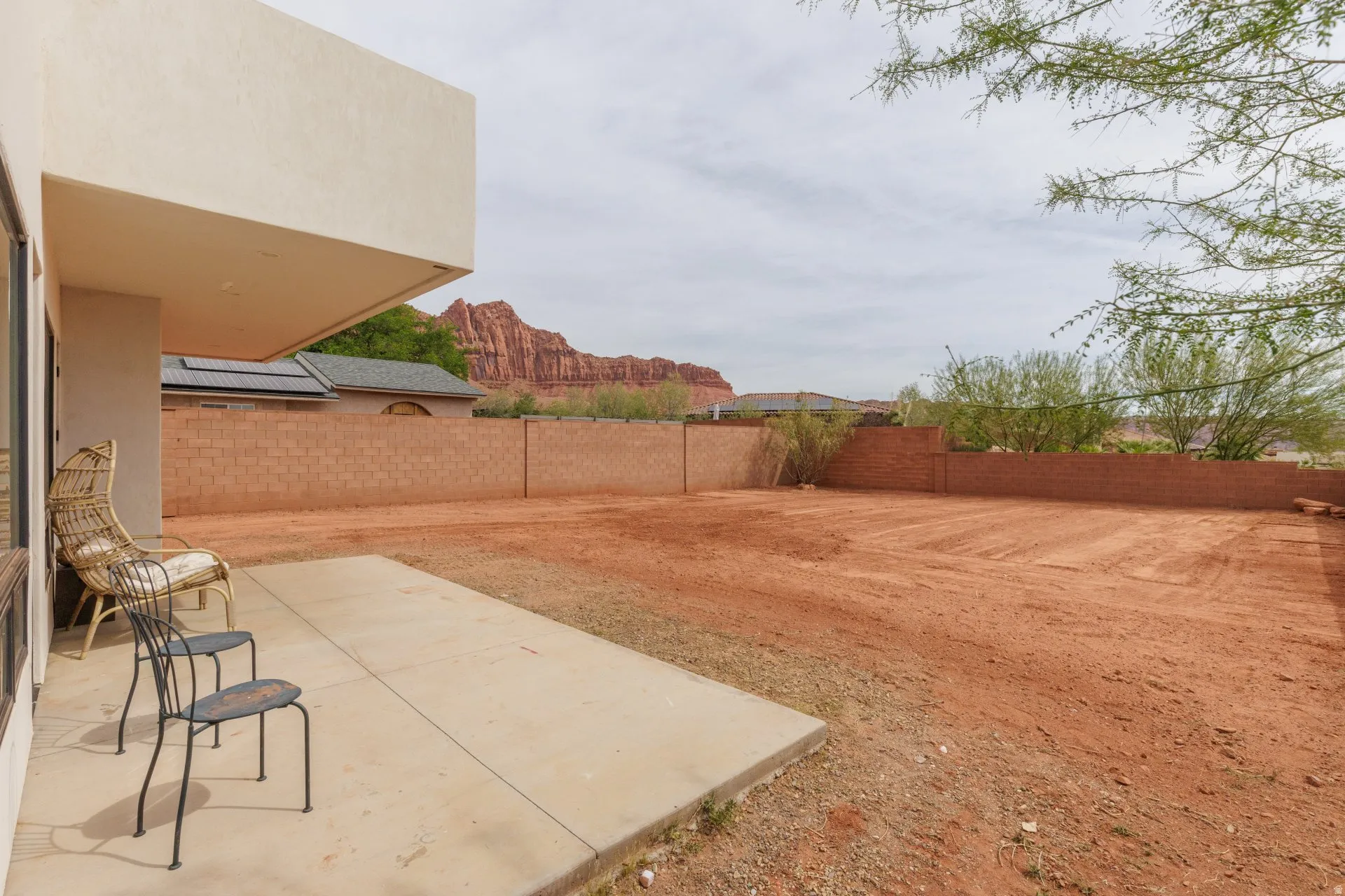 Fenced backyard featuring a patio
