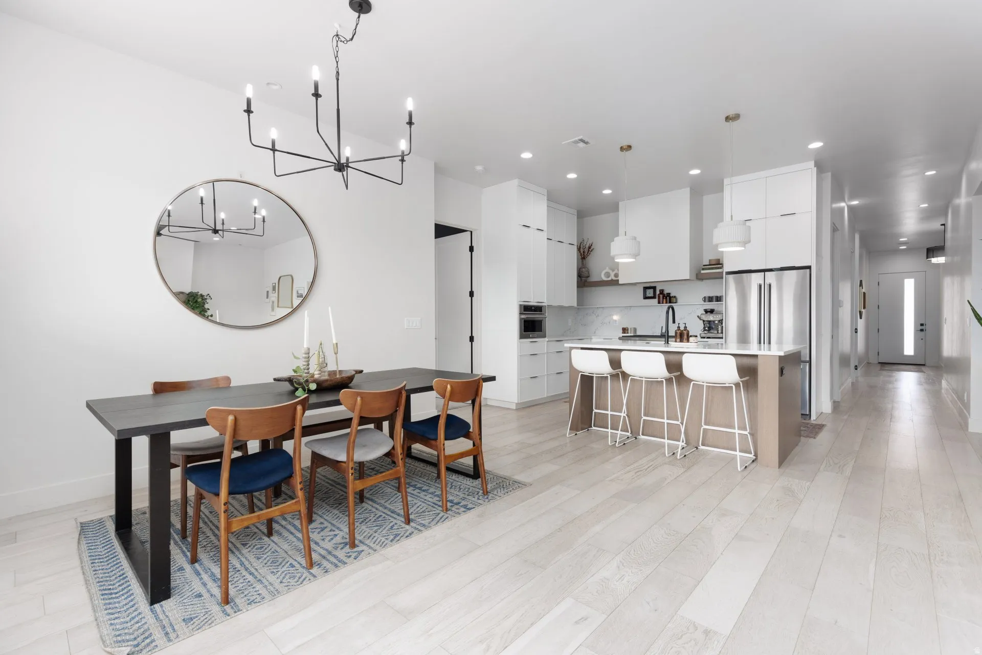 Dining room featuring suspended lighting and light wood finished floors