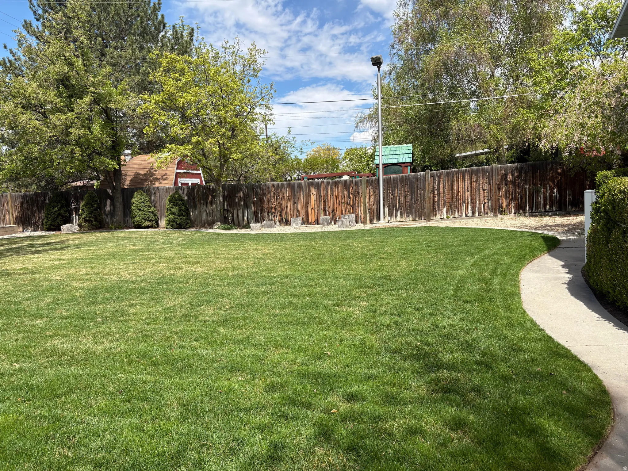 View of fenced backyard