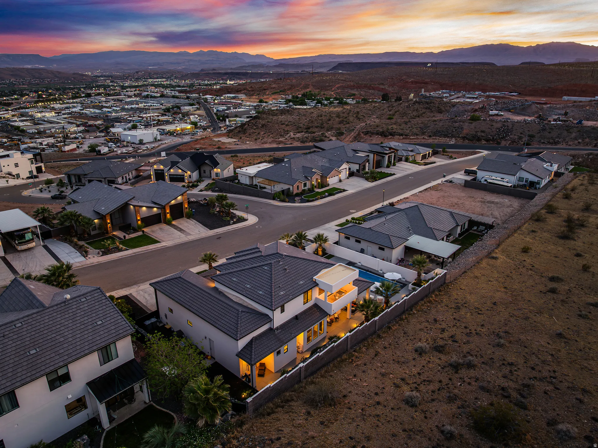 Aerial view at dusk of a residential view and a mountain view