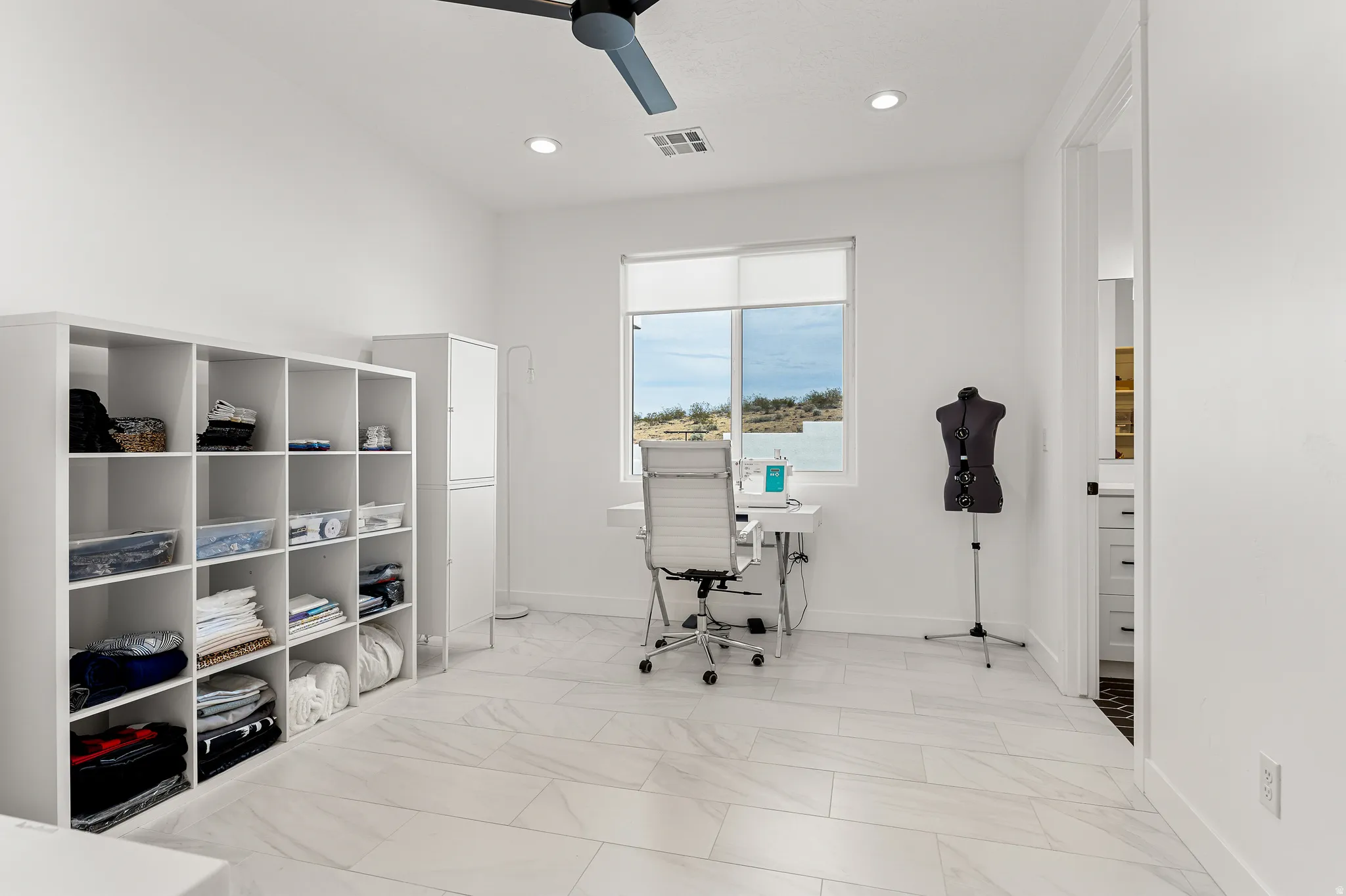 Office area featuring ceiling fan, light marble finish flooring, and recessed lighting