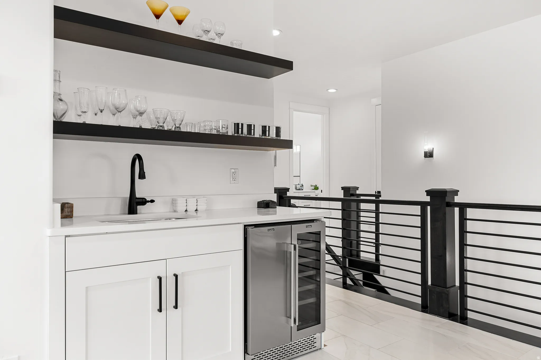 Bar area featuring open shelves, beverage cooler, white cabinets, and recessed lighting