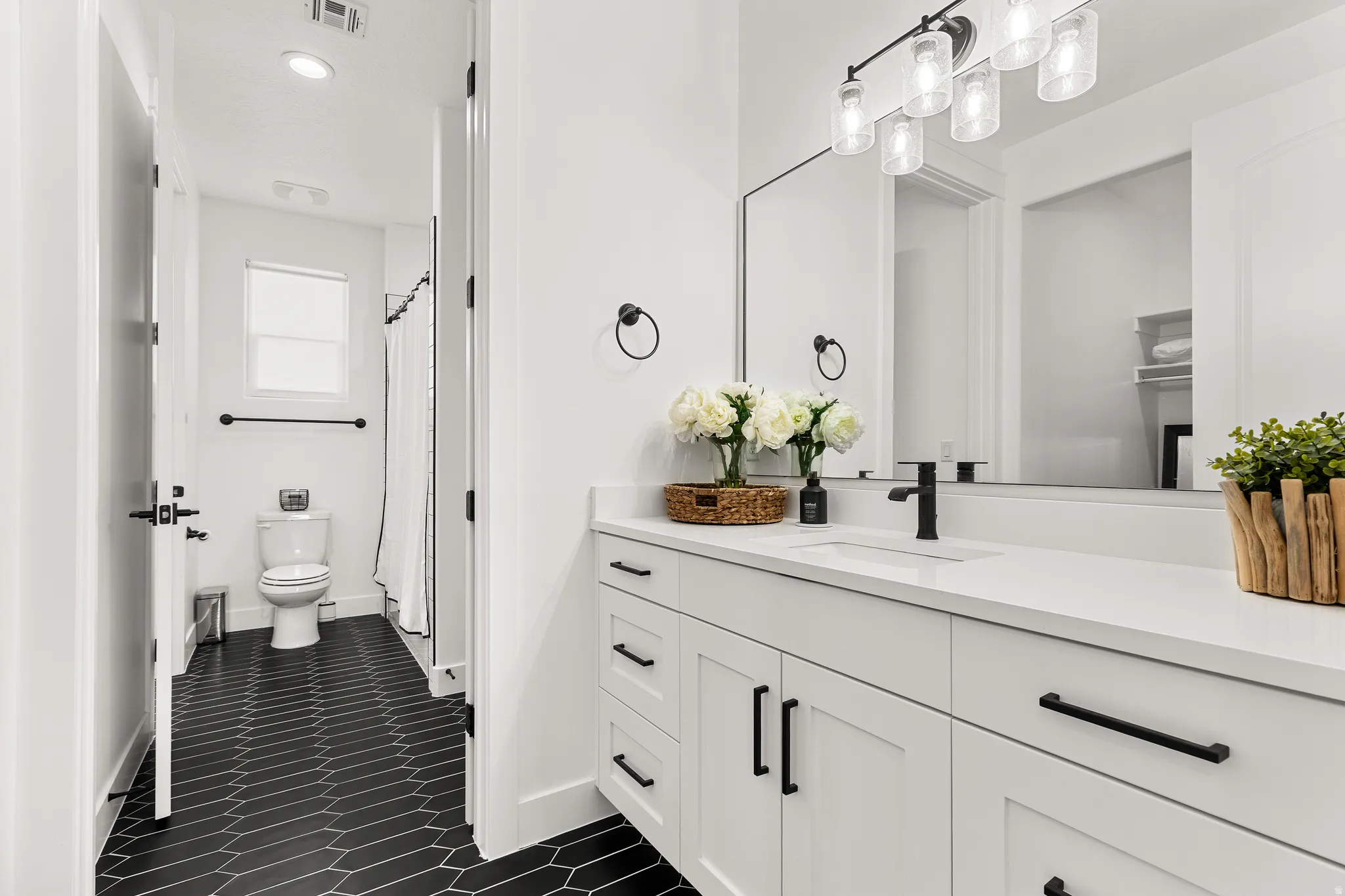 Full bath with vanity, a shower with curtain, dark tile patterned floors, and recessed lighting