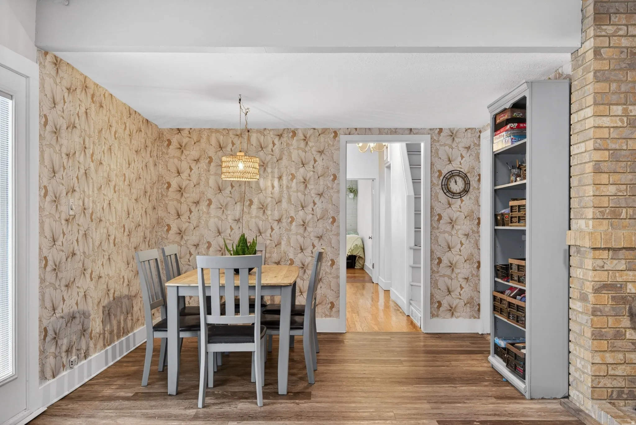 Dining room featuring wood finished floors and baseboards