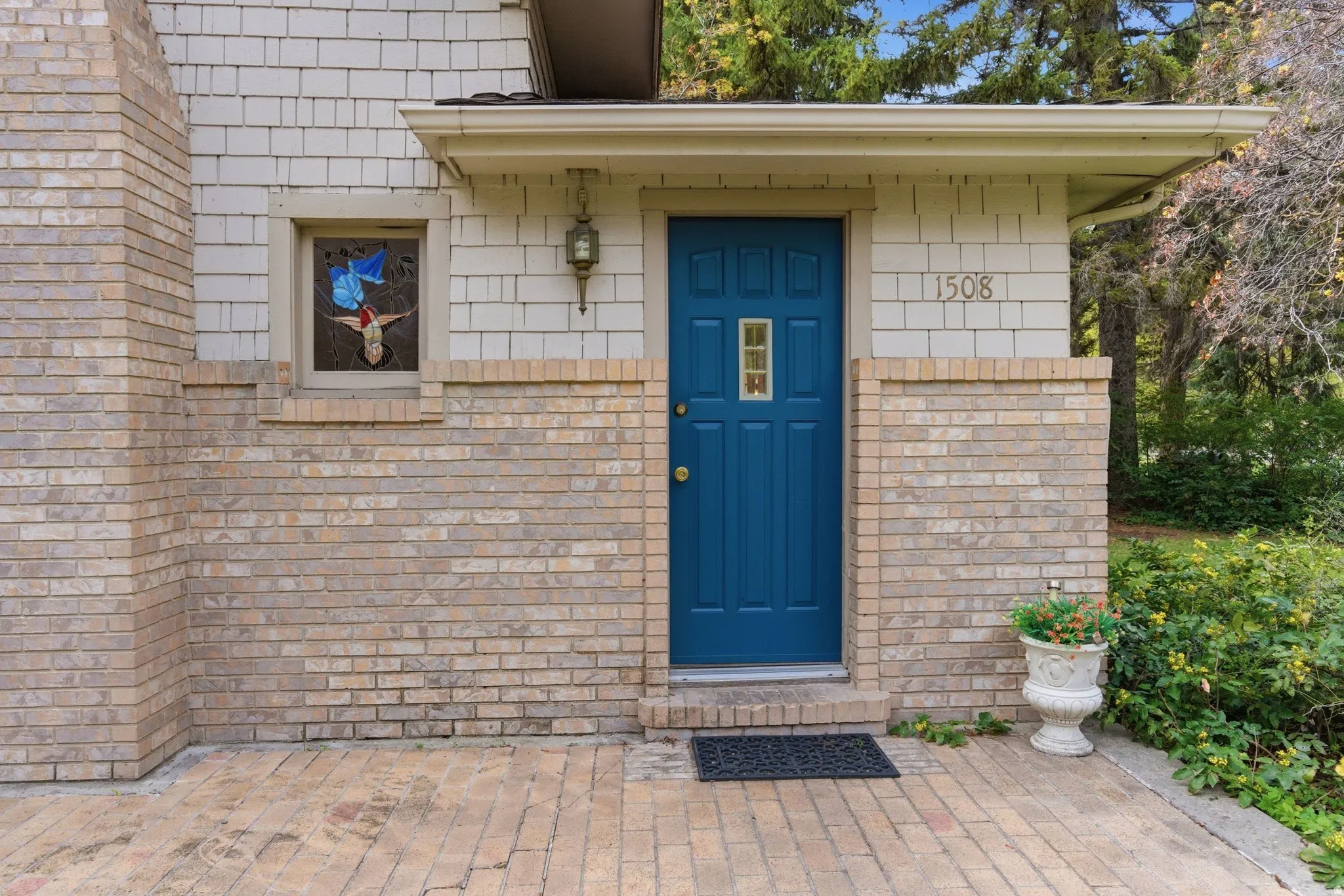 Property entrance with a patio