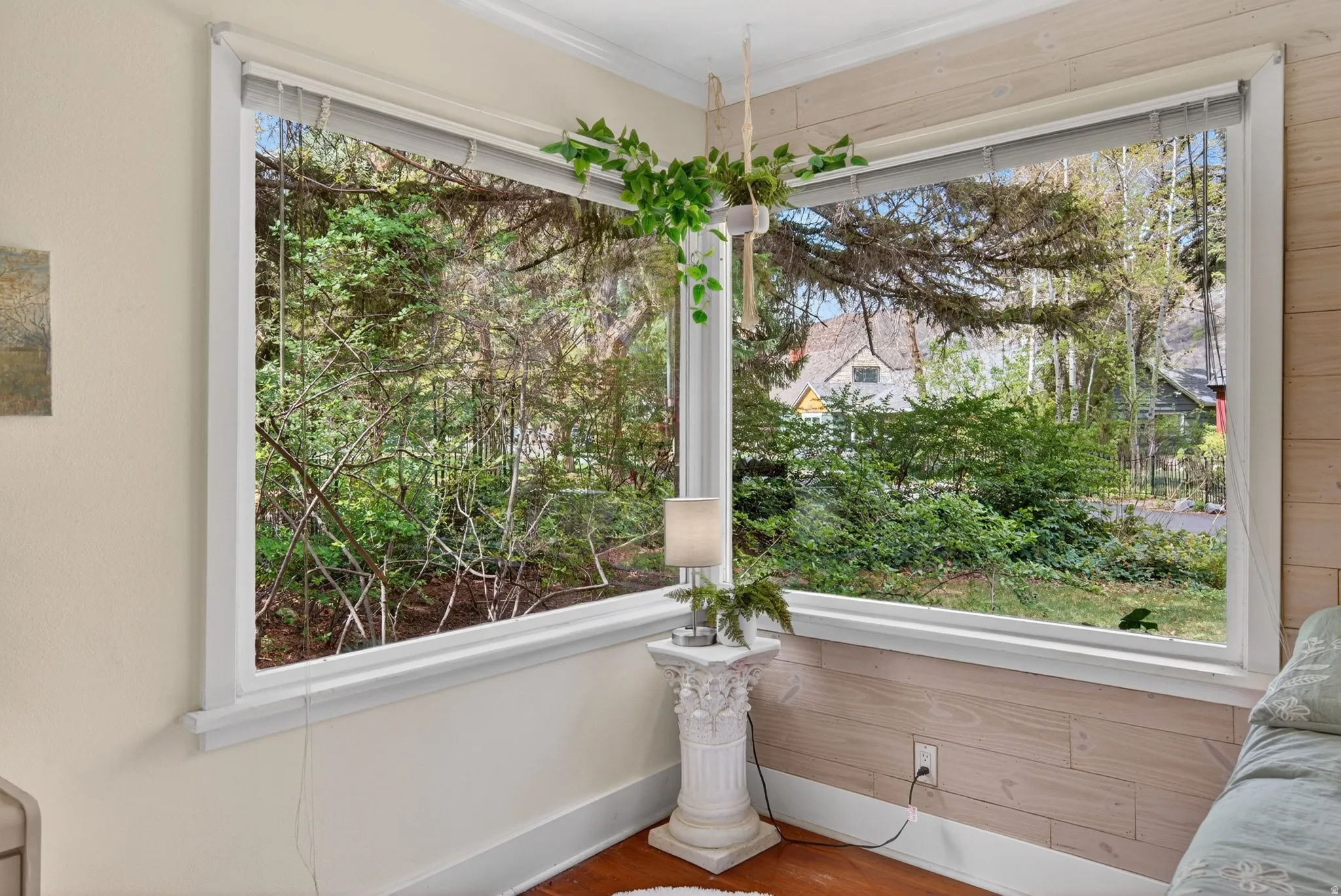 Unfurnished room featuring wood finished floors and crown molding