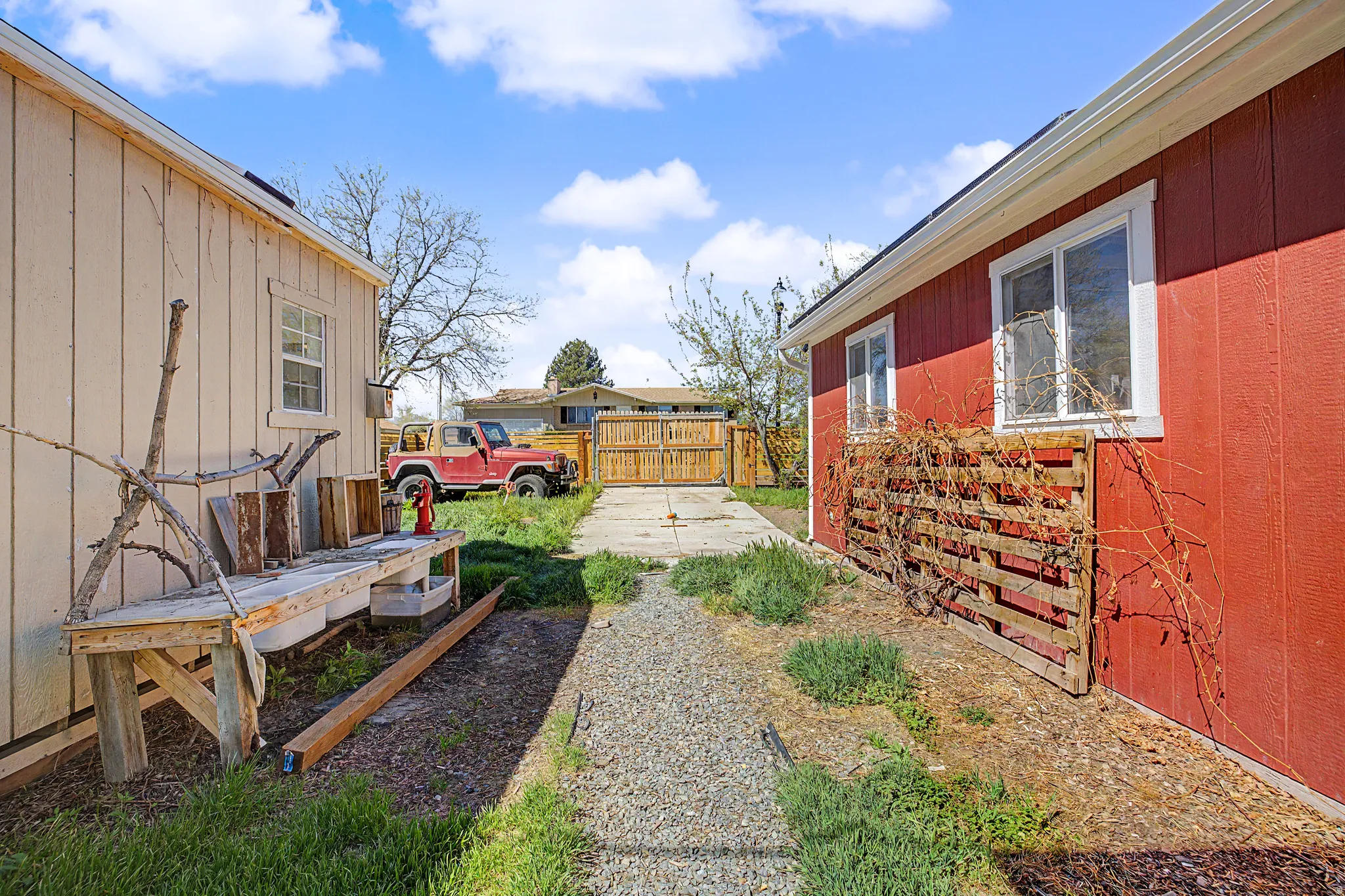 View of yard featuring a gate, rv pad