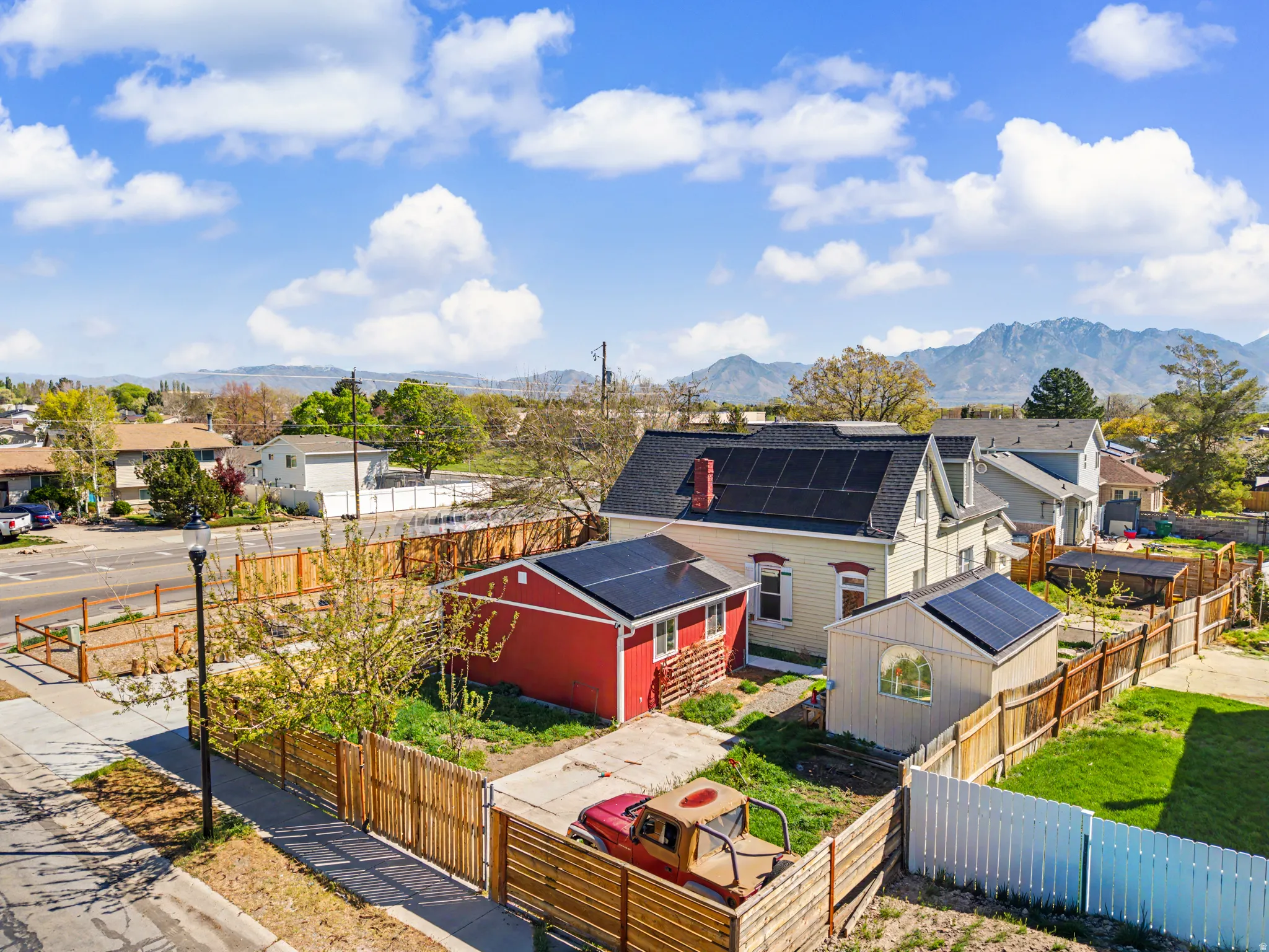 Aerial perspective of suburban area featuring a mountainous background