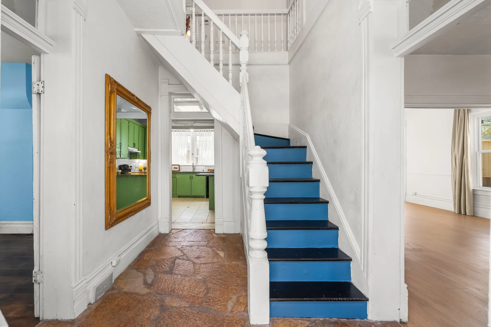 Stairway featuring baseboards and stone finish flooring