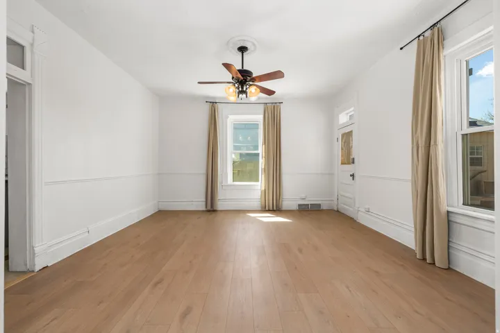 Dining room featuring light wood-style flooring and a ceiling fan