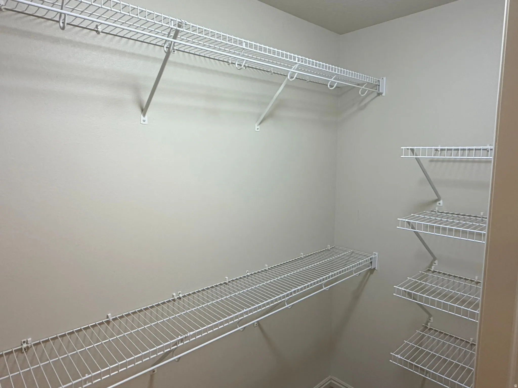 Walk in closet in principal suite