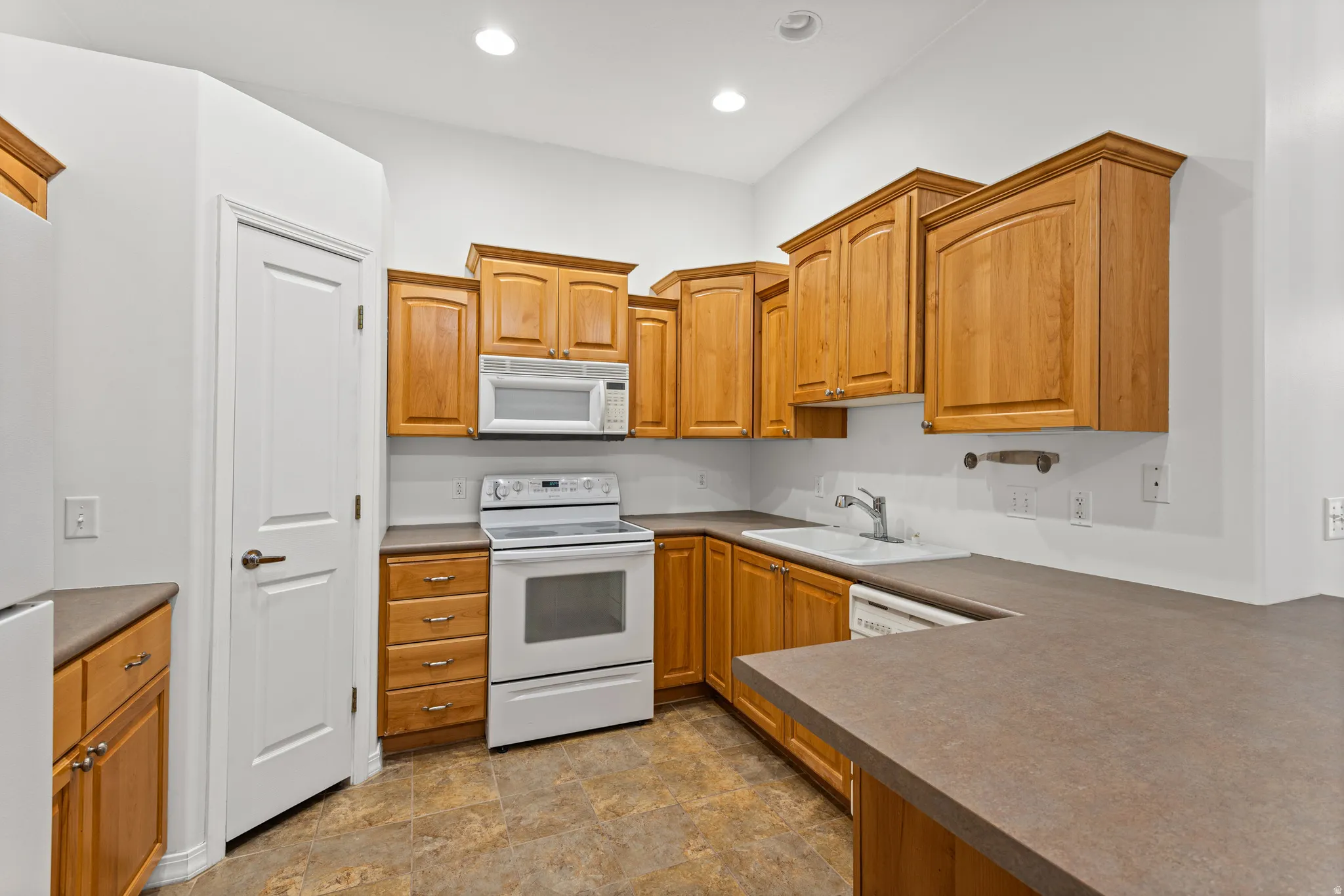 This is more than a one person kitchen - with a large pantry to hold you culinary tools.