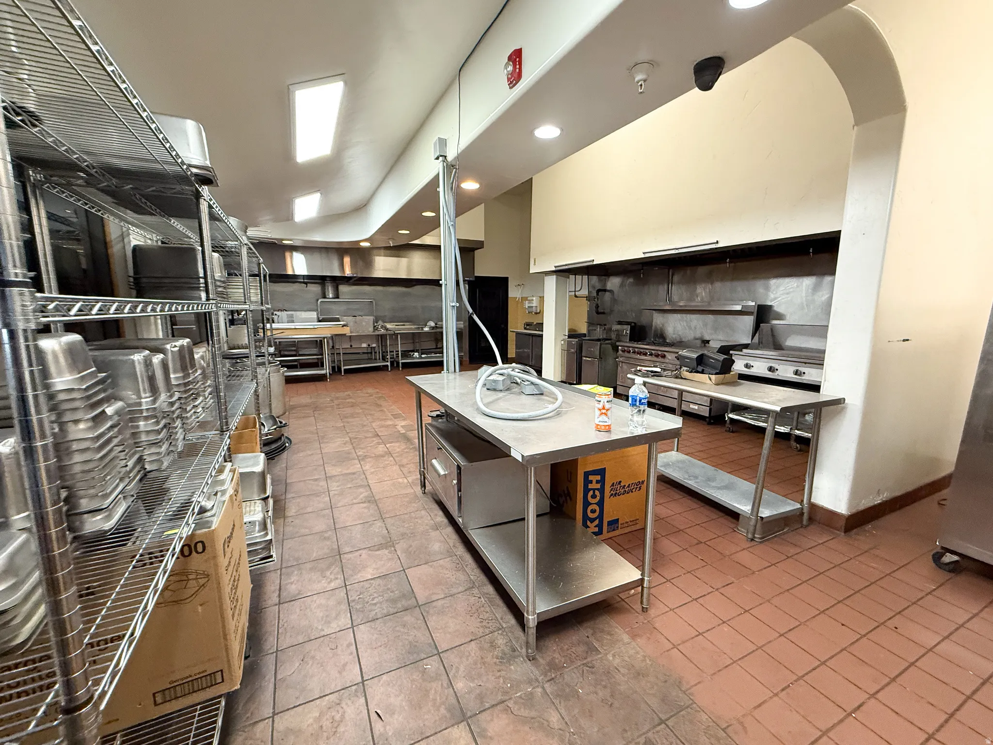 Kitchen featuring recessed lighting, stainless steel range, and a kitchen island
