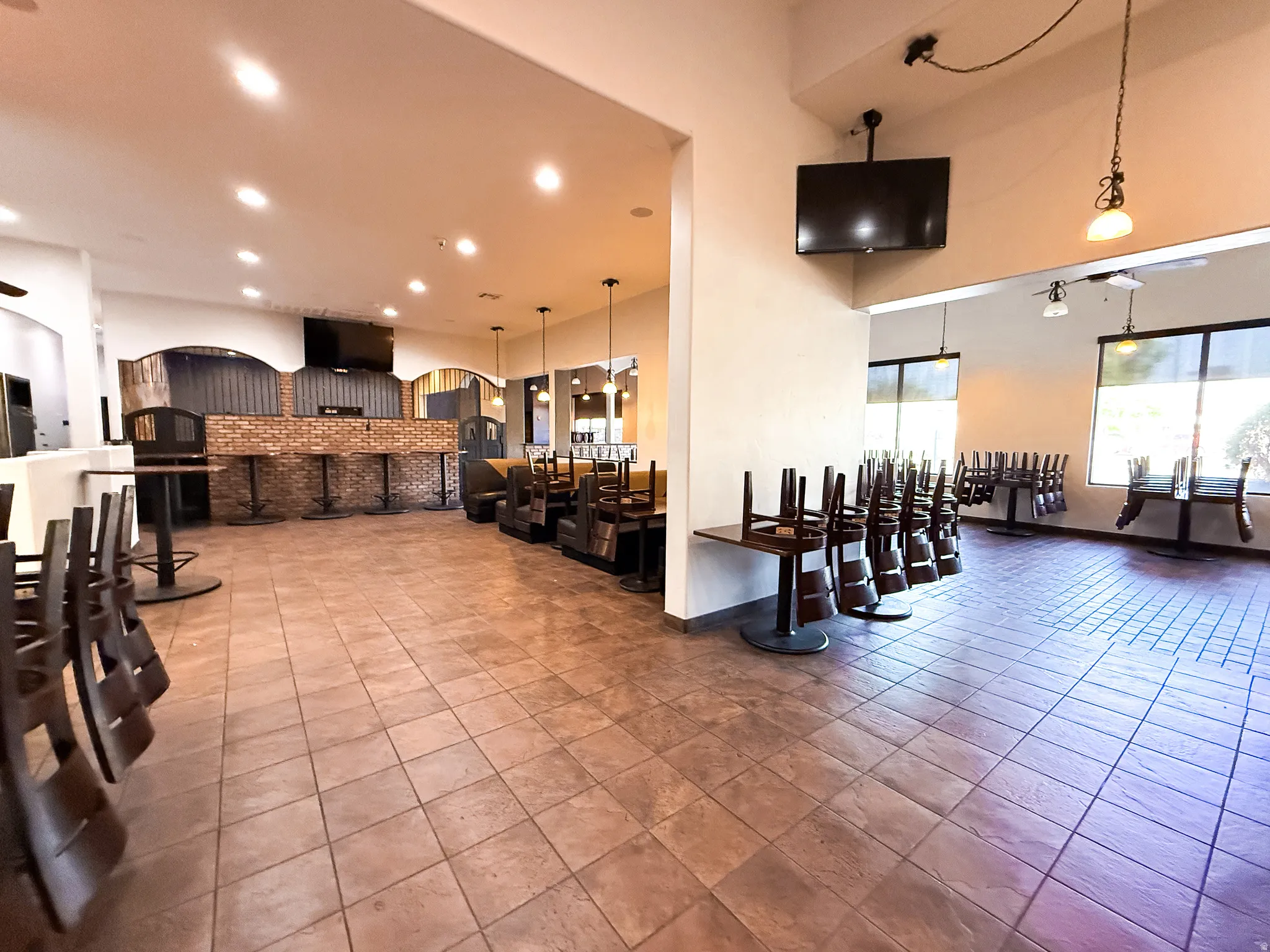 Miscellaneous room featuring recessed lighting and a high ceiling