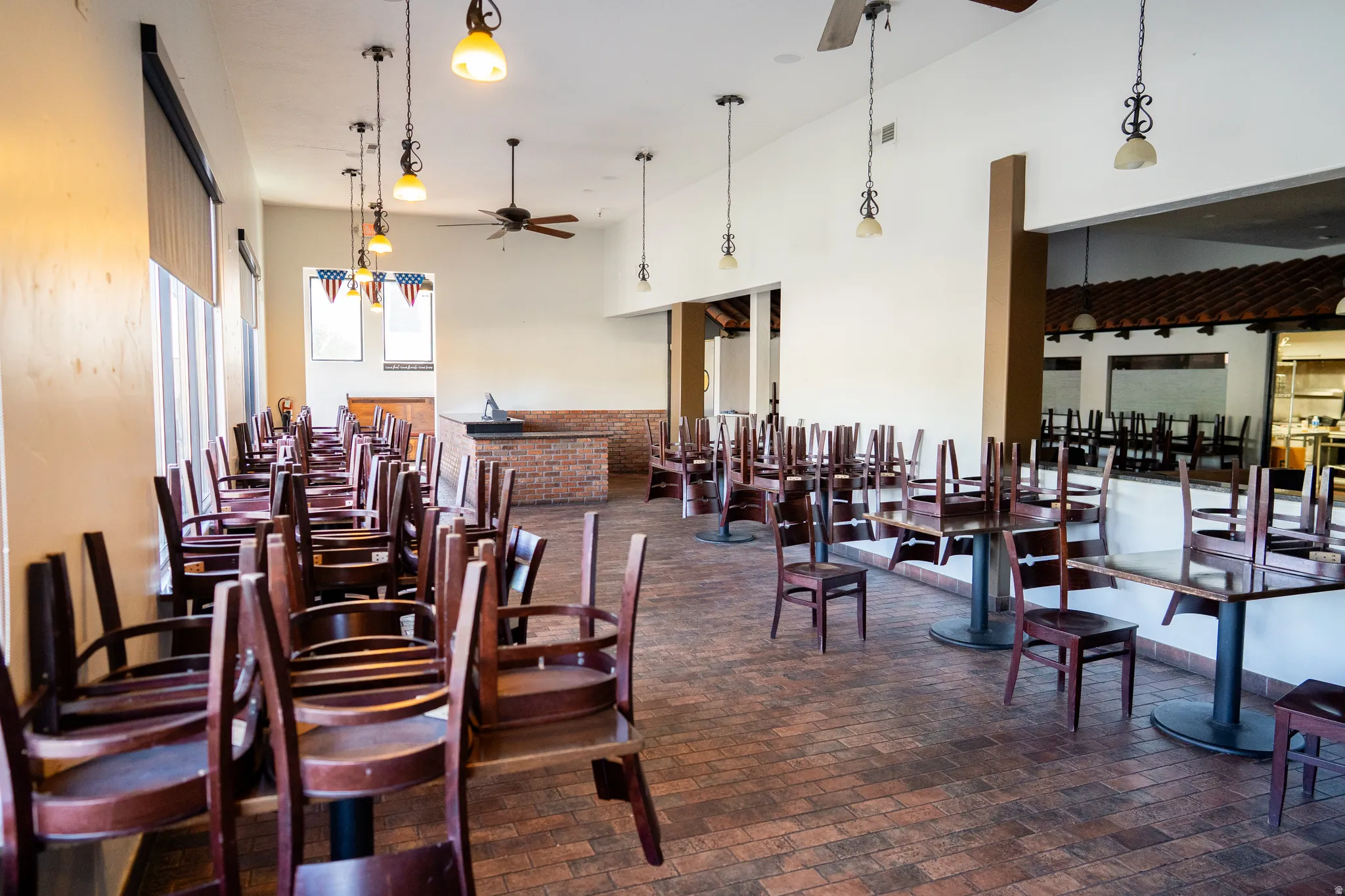 Miscellaneous room featuring ceiling fan and a high ceiling