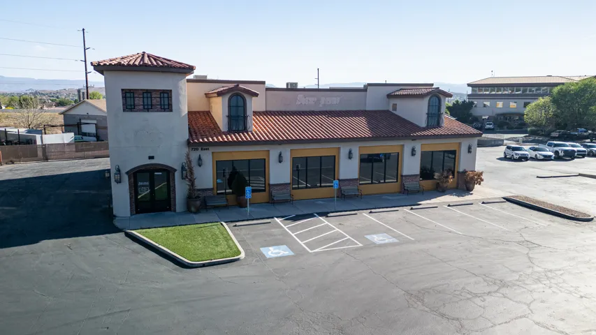 View of commercial location with uncovered parking