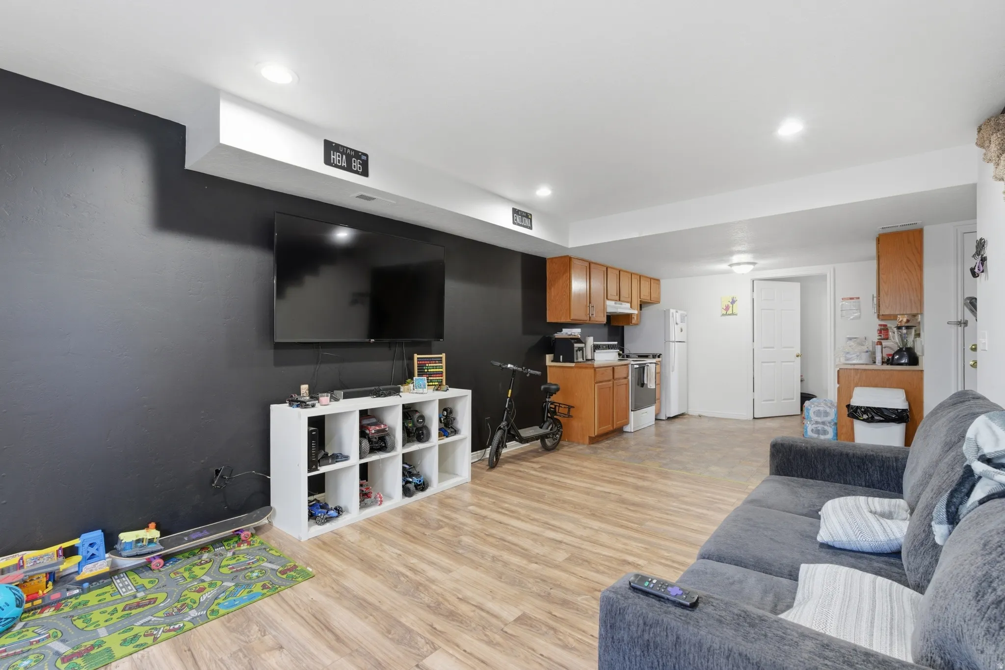 Living room featuring light wood-style floors and recessed lighting
