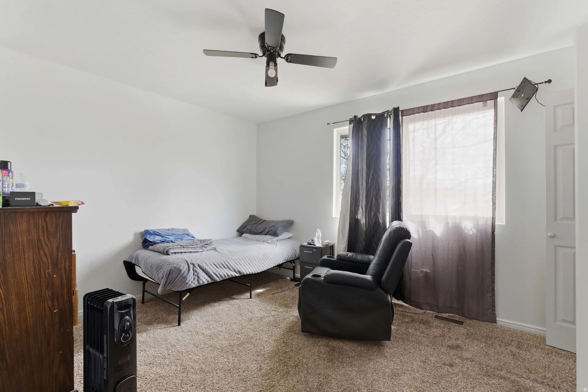 Bedroom featuring carpet and a ceiling fan