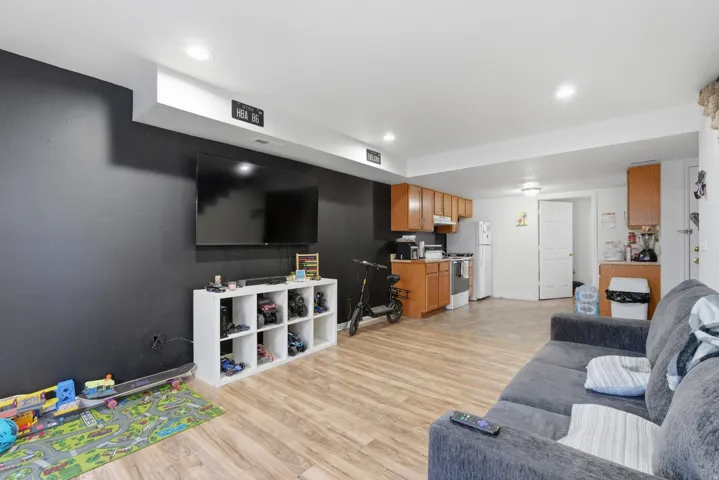 Living room featuring light wood-style floors and recessed lighting