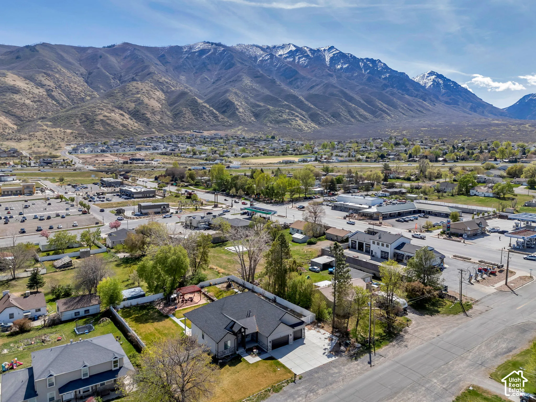 Aerial perspective of suburban area featuring a mountainous background