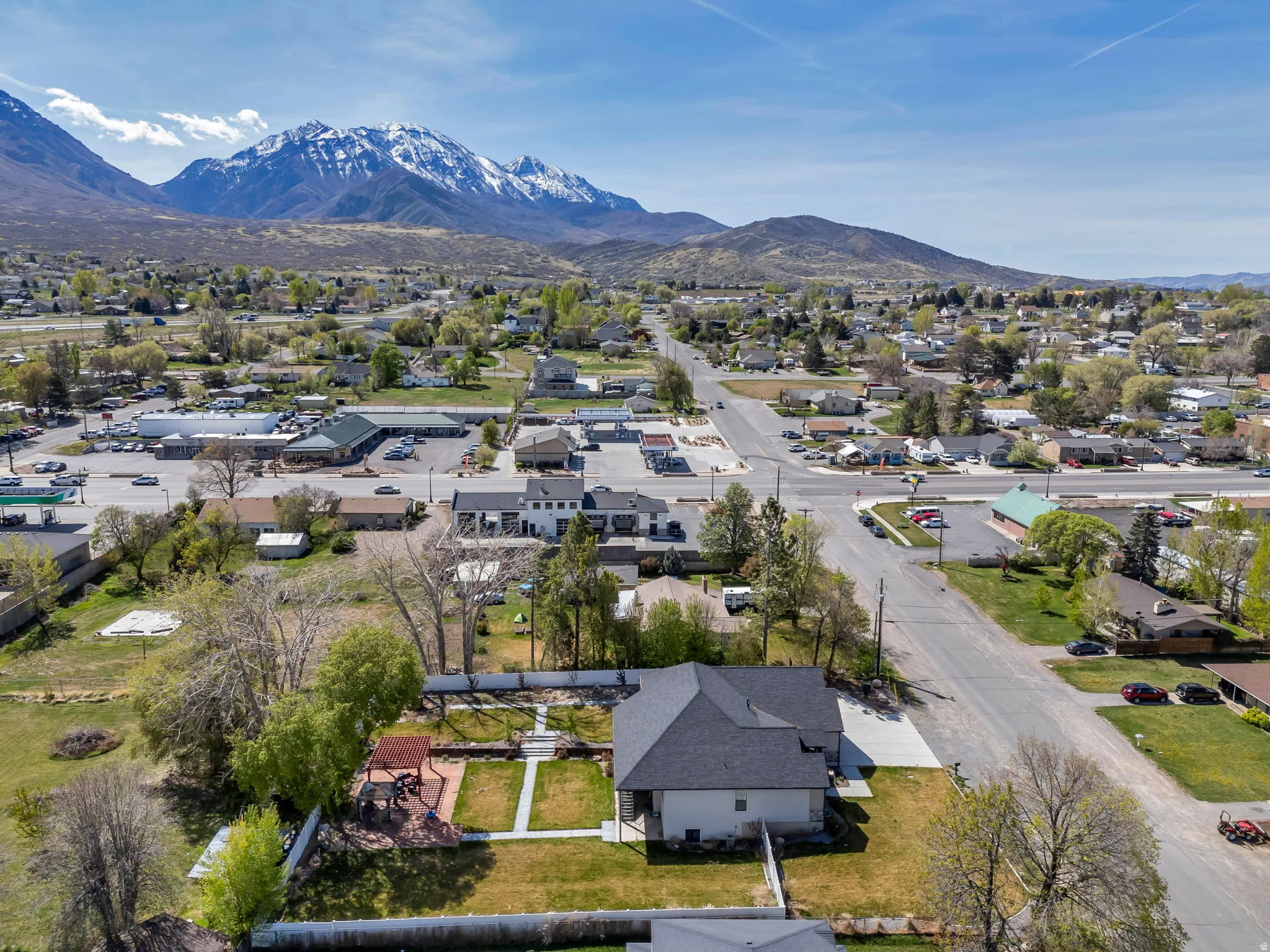 Aerial view of residential area featuring a mountainous background