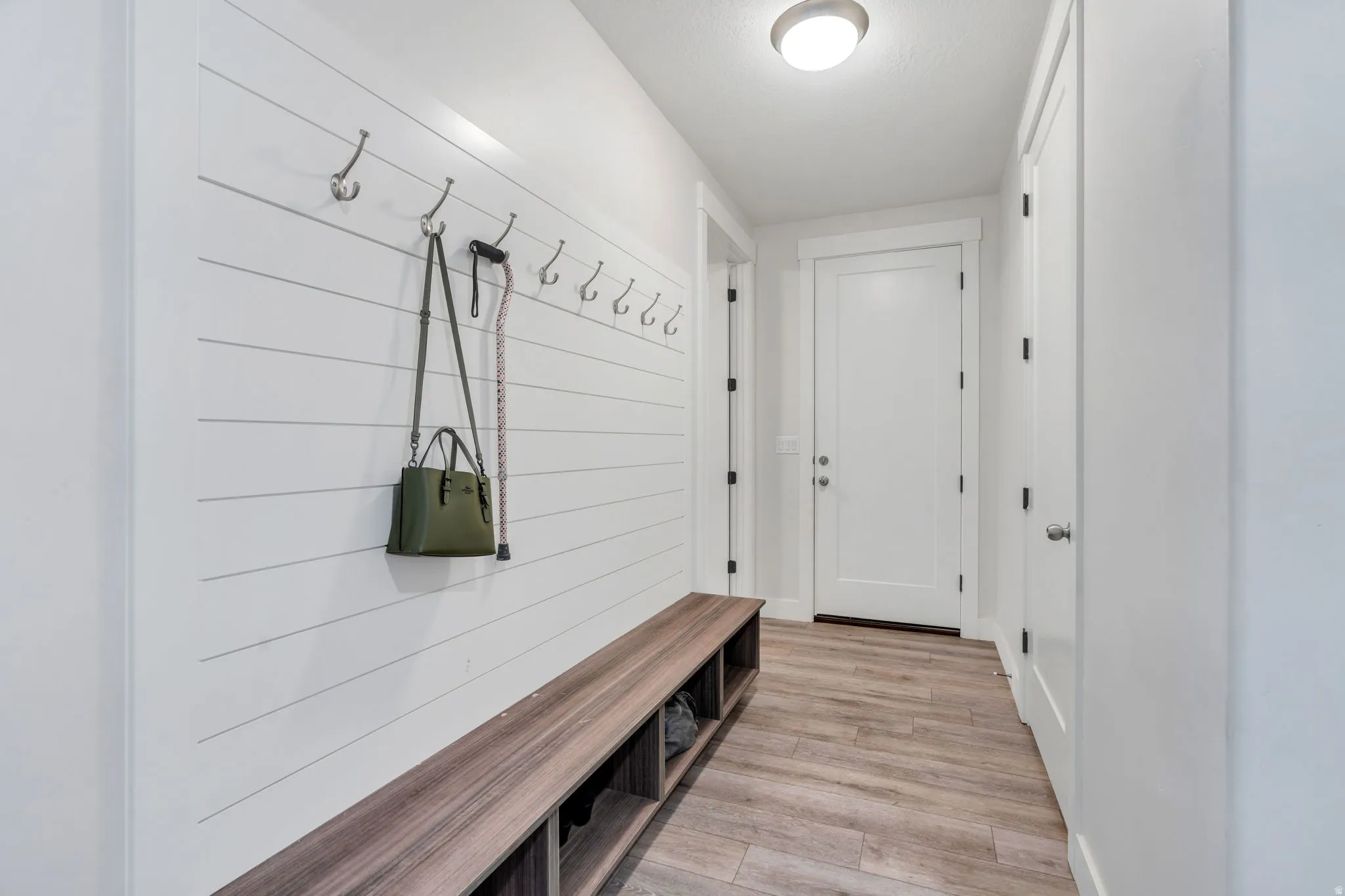 Mudroom area with storage