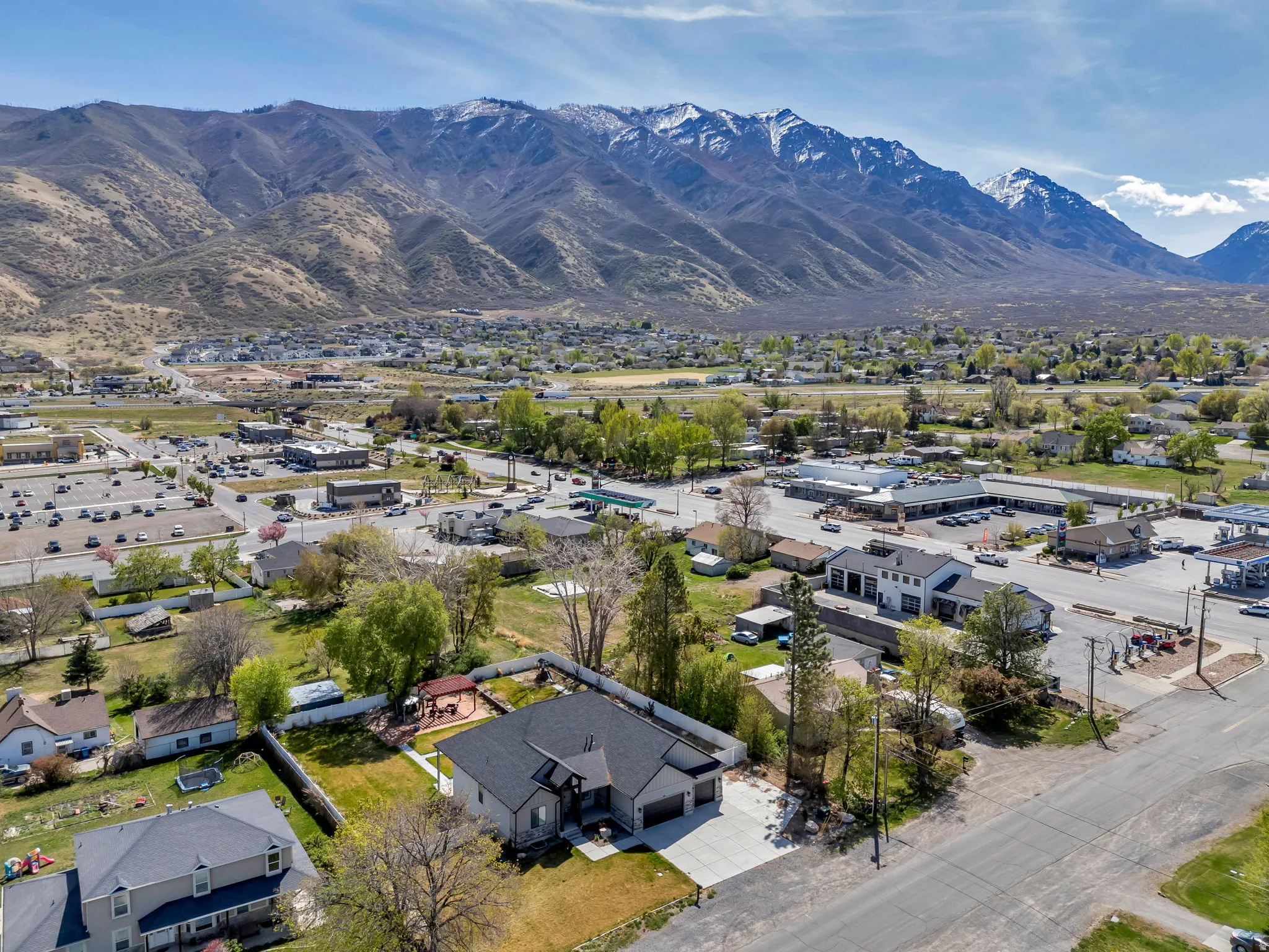 Aerial perspective of suburban area featuring a mountainous background