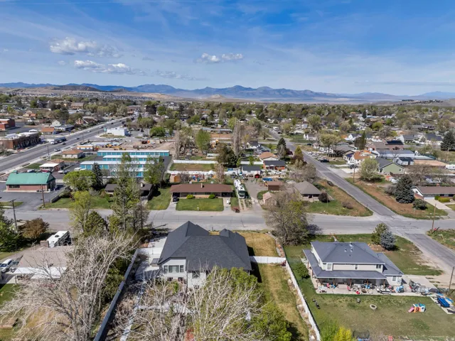 Aerial perspective of suburban area with a mountainous background