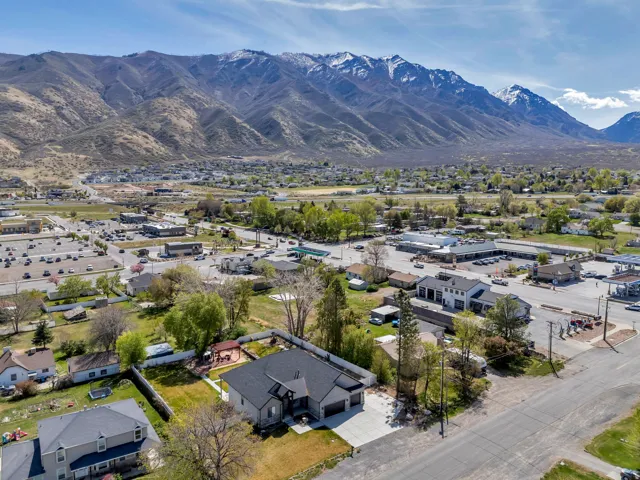 Aerial perspective of suburban area featuring a mountainous background