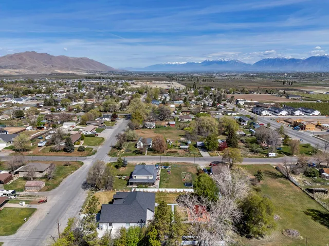 View of property location featuring nearby suburban area and a mountainous background