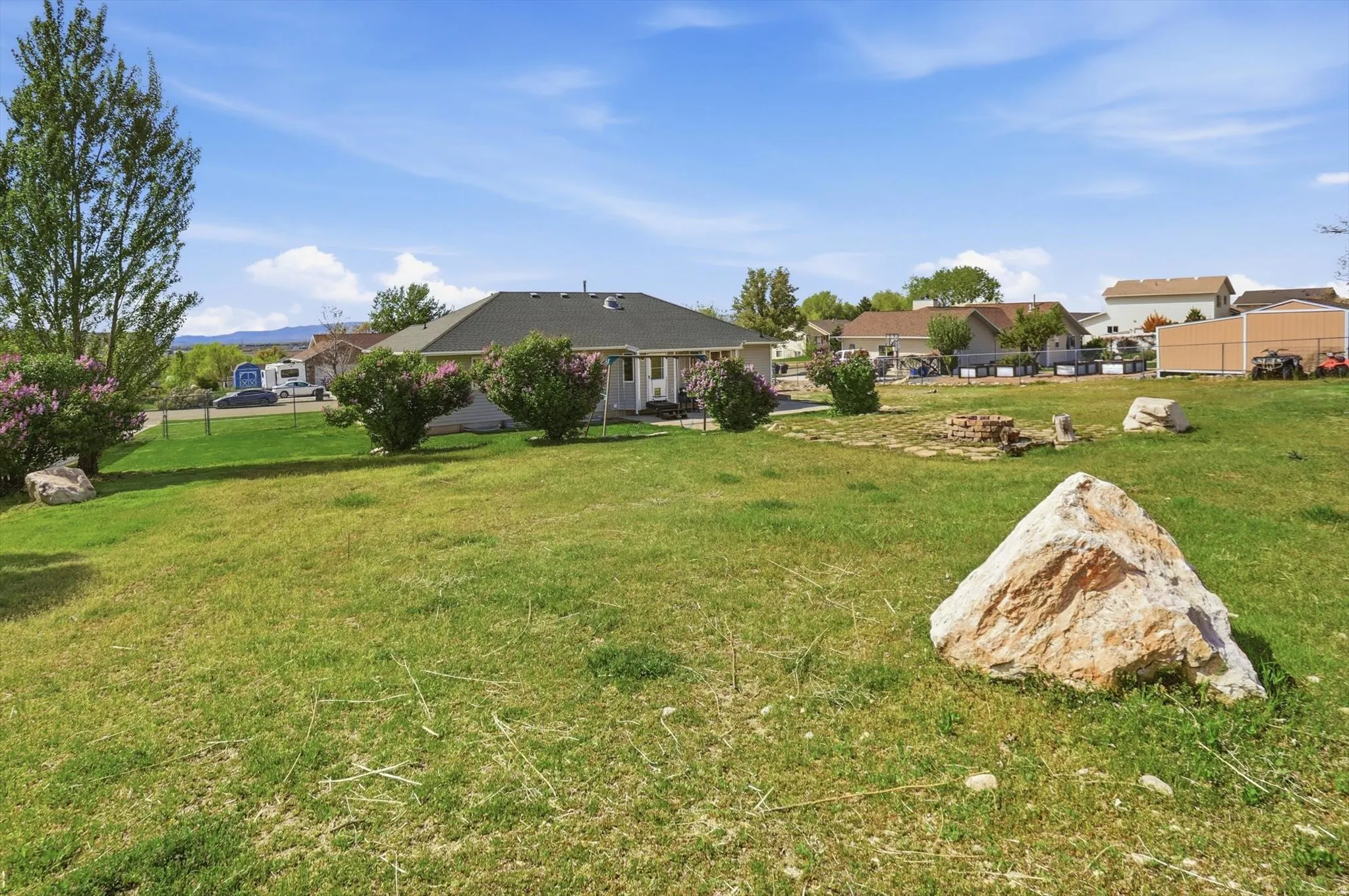 View of yard featuring a residential view and a patio area