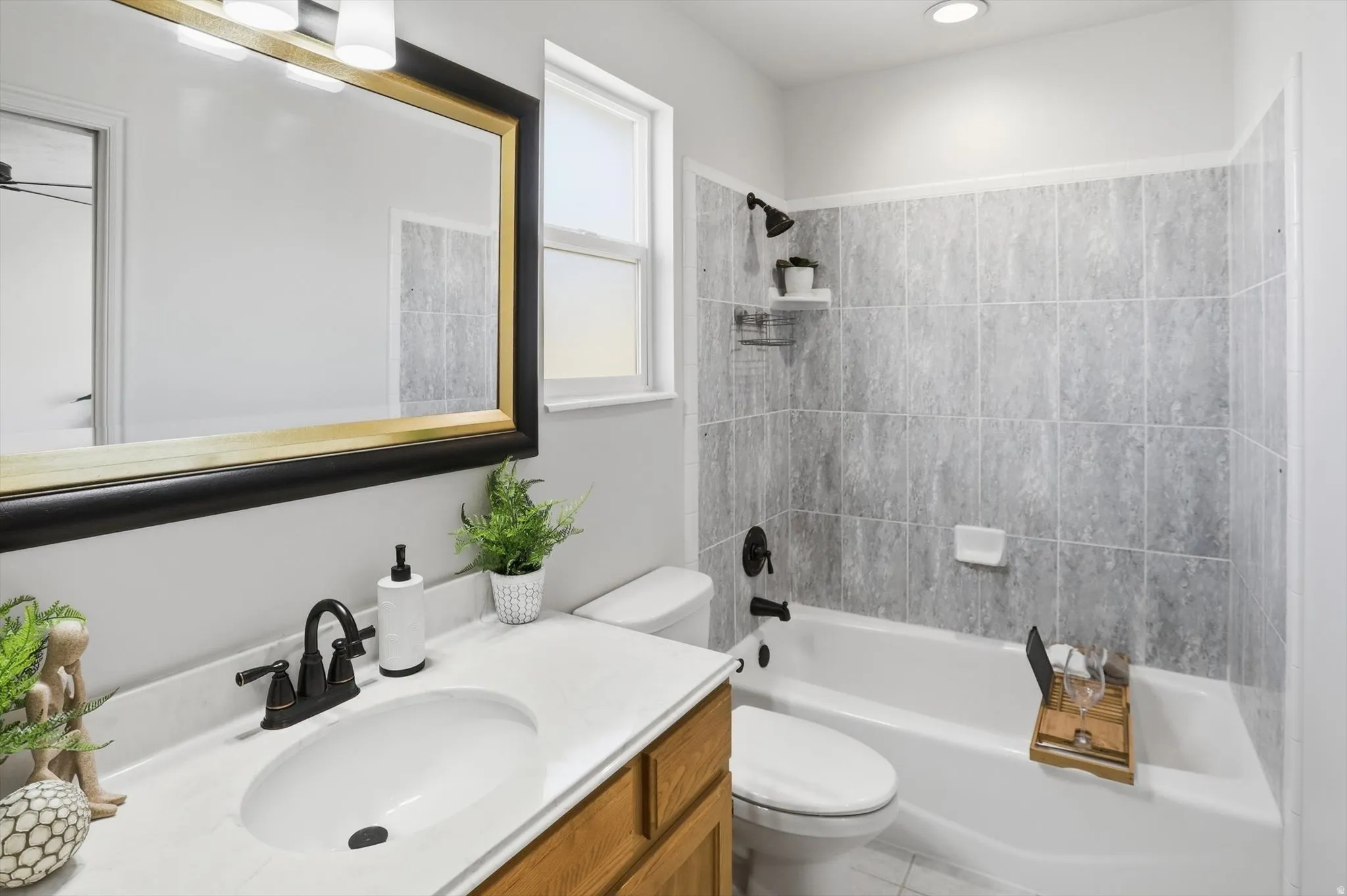 Primary bathroom with vanity and shower / bath combination