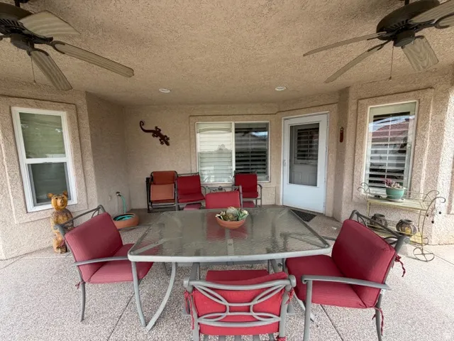 View of patio featuring ceiling fan and outdoor dining space