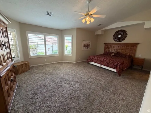Bedroom featuring carpet flooring and ceiling fan