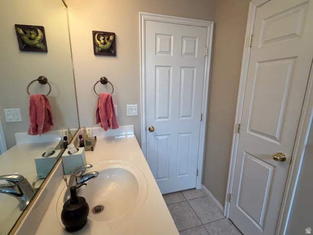 Bathroom featuring vanity and light tile patterned floors