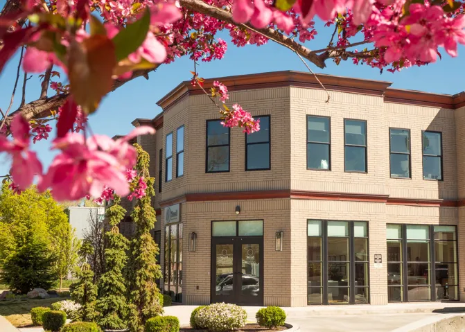 Rear view of house featuring brick siding