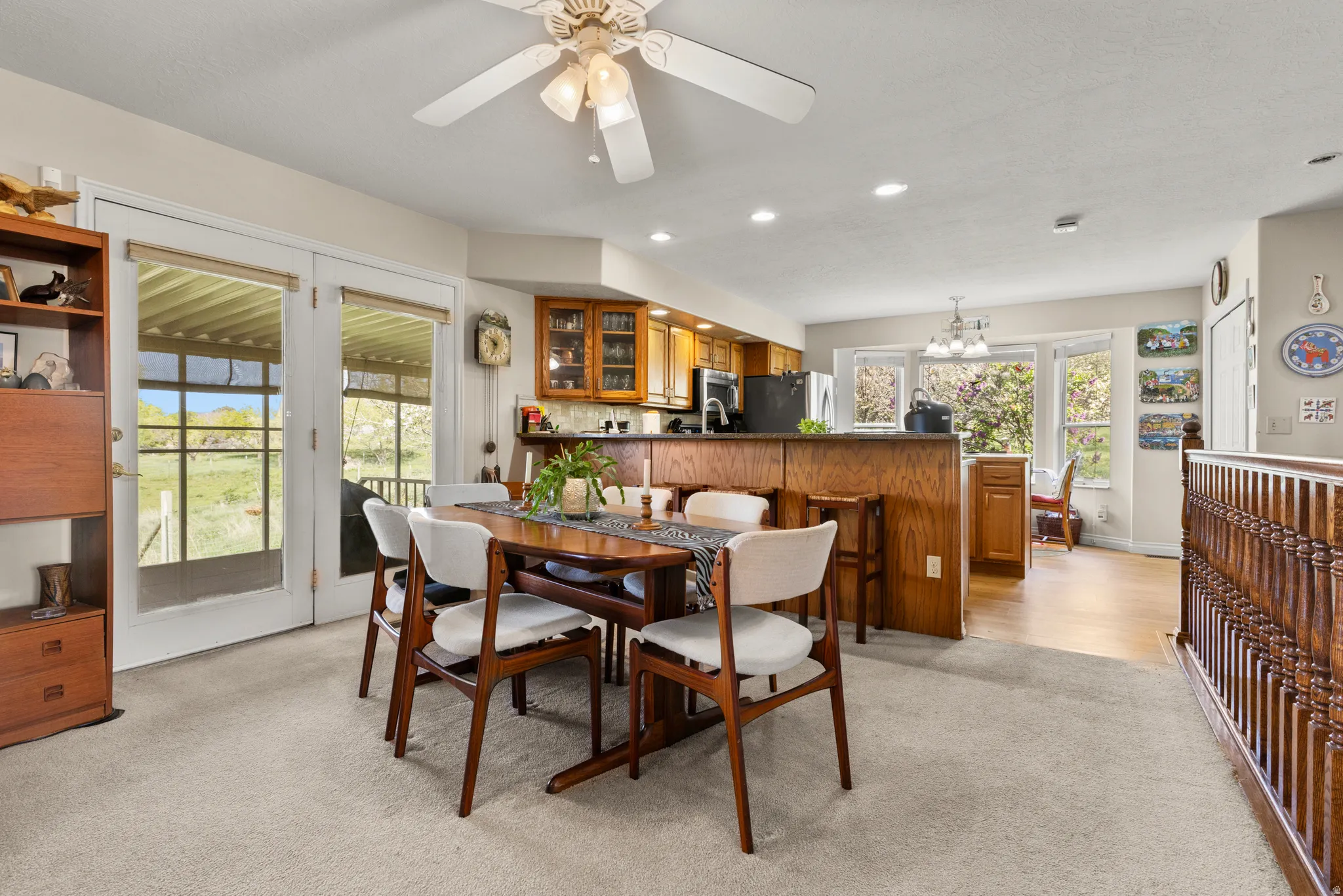 Dining room featuring light colored carpet, recessed lighting, and ceiling fan
