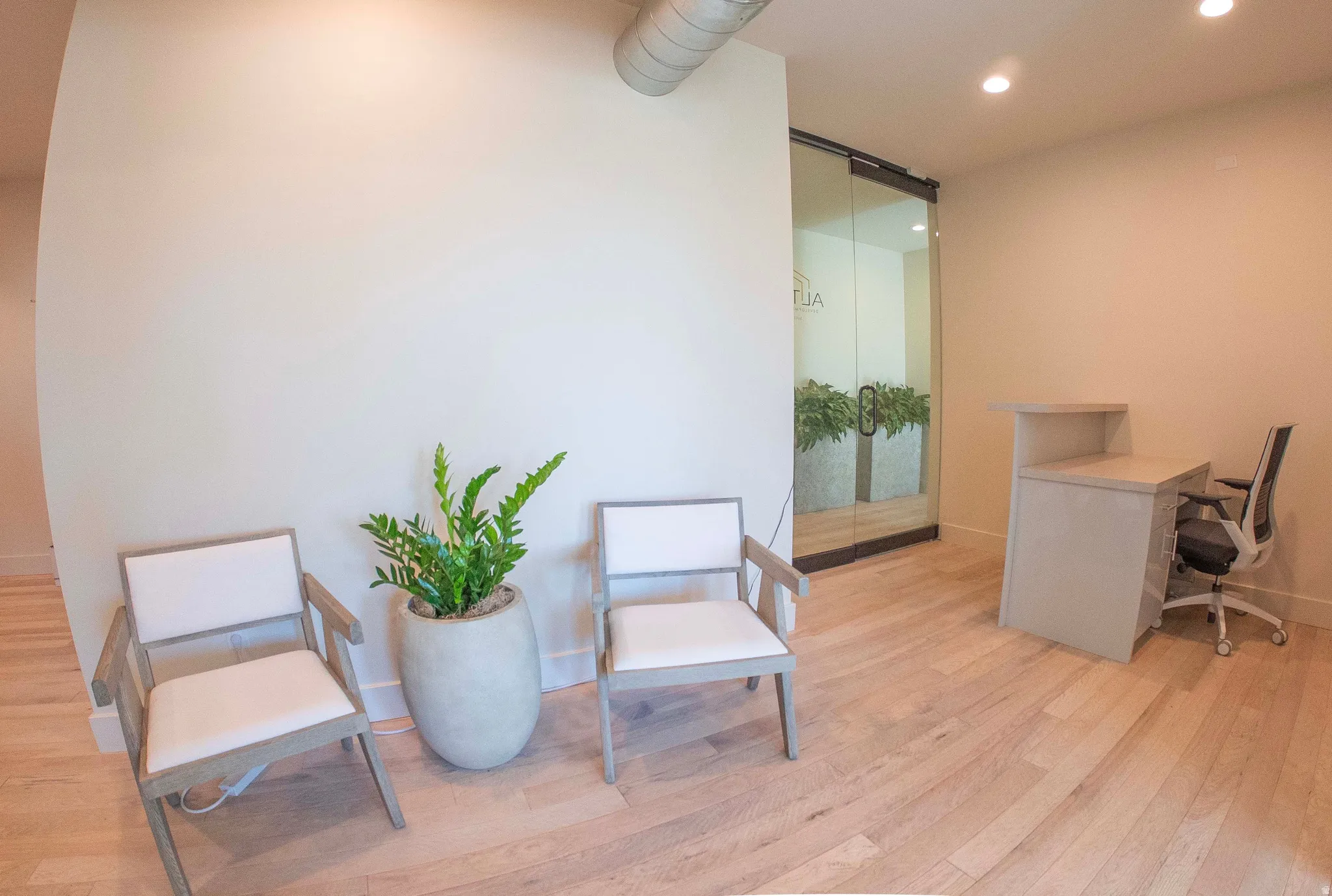Office area with recessed lighting and a barn door